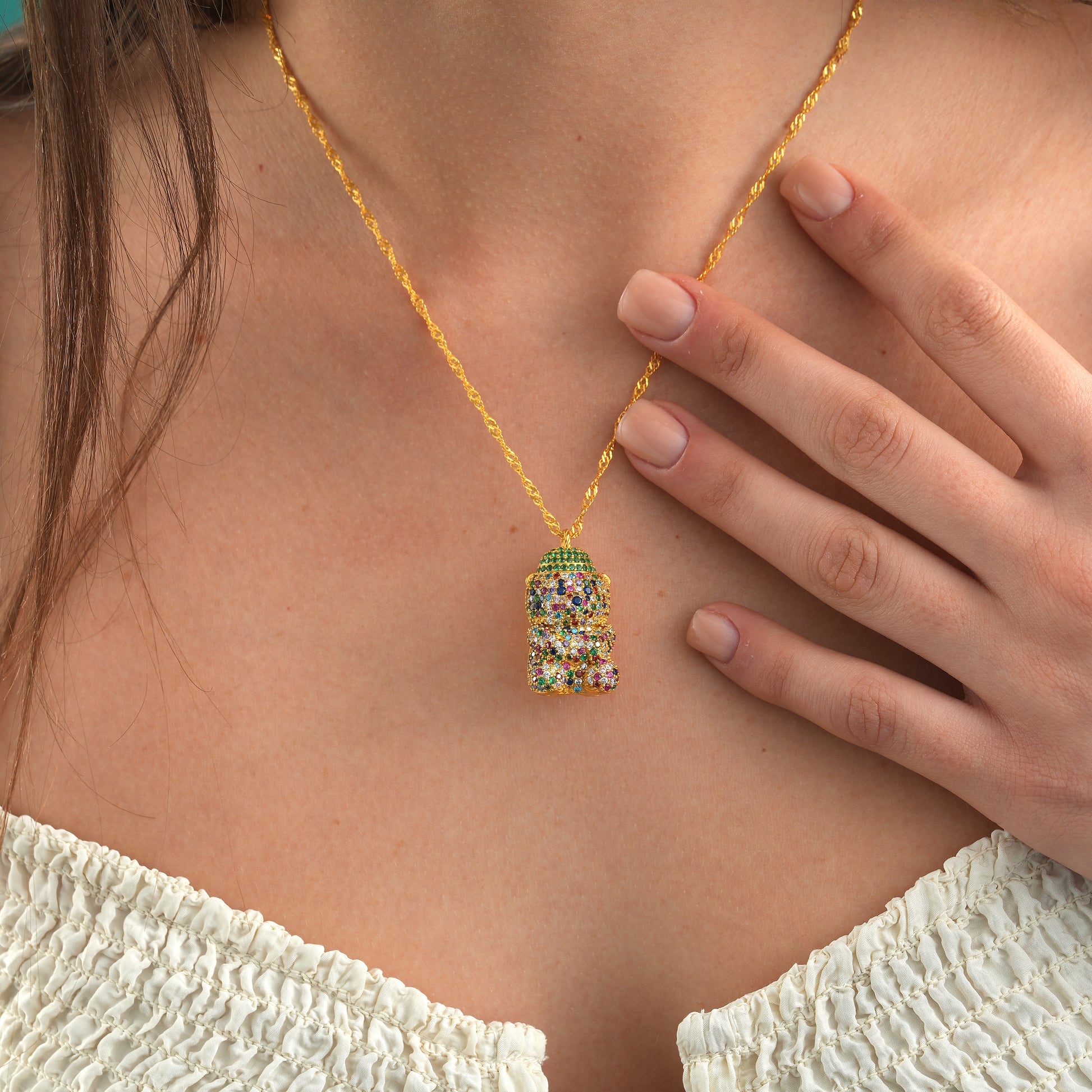 3D Teddy Bear Necklace with colorful cubic zirconia on a chain worn by a model.