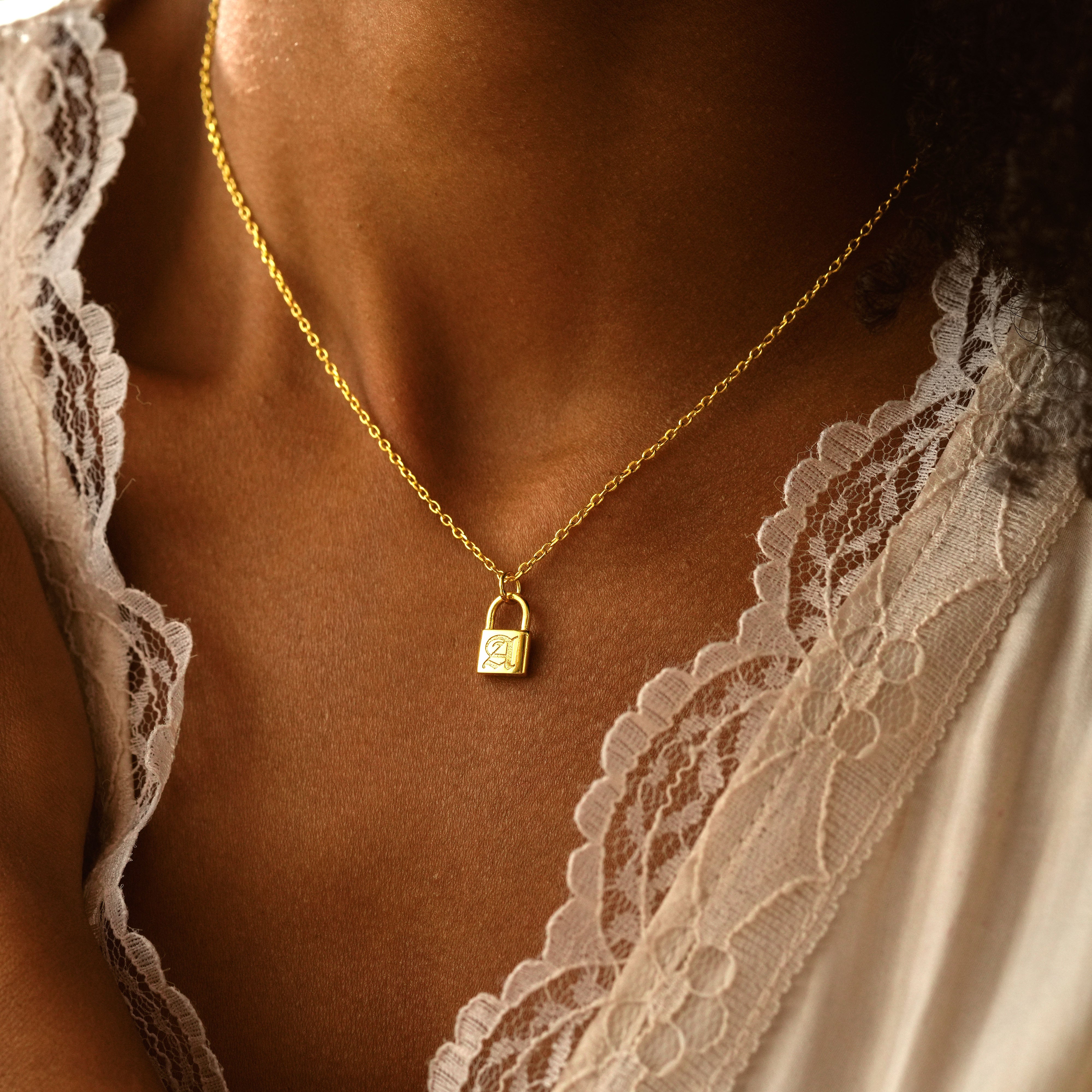 Personalized Initial Padlock Necklace worn by a model, featuring a gold filled padlock charm on a delicate chain.