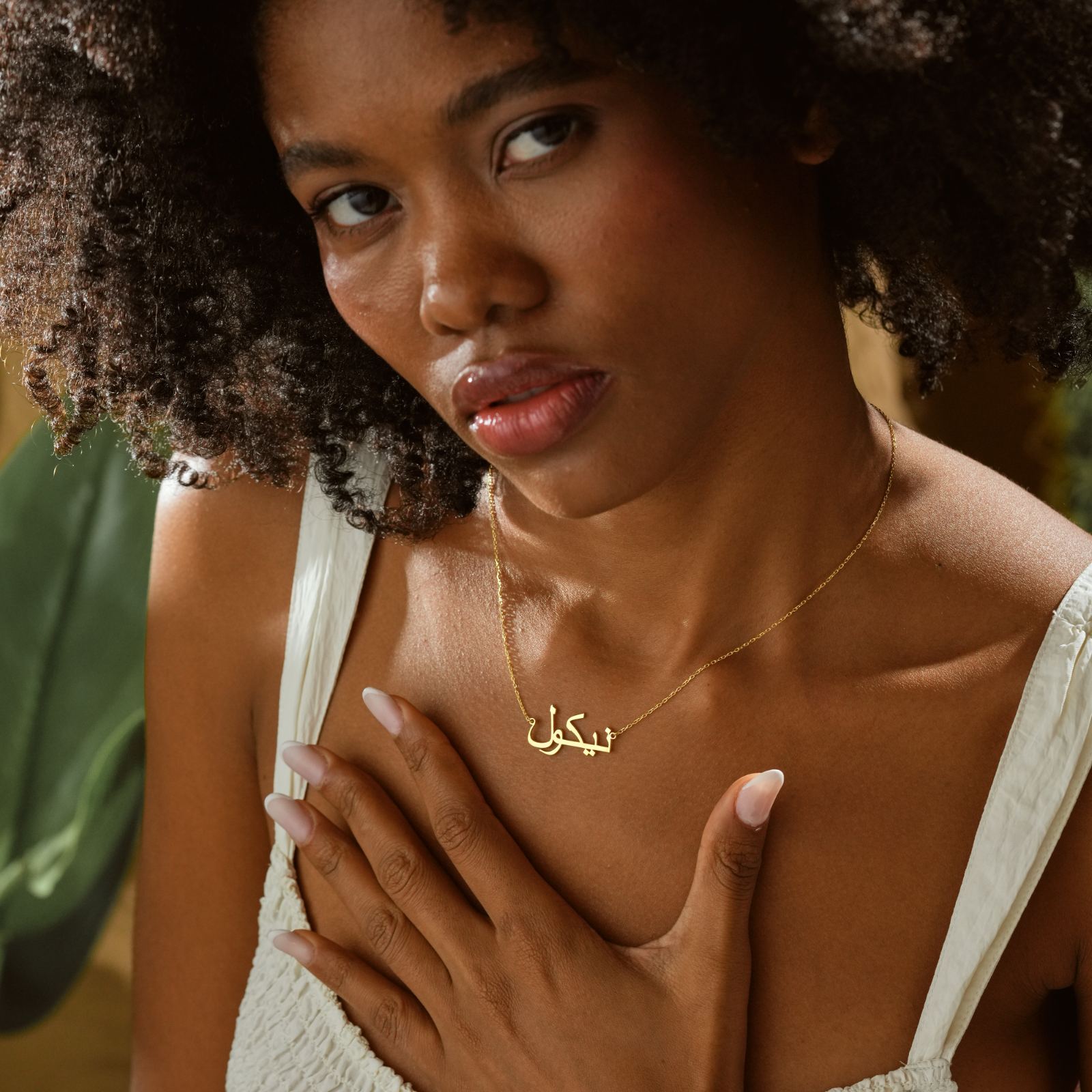 Personalized Arabic Name Necklace worn by a model, featuring gold vermeil finish and delicate design.