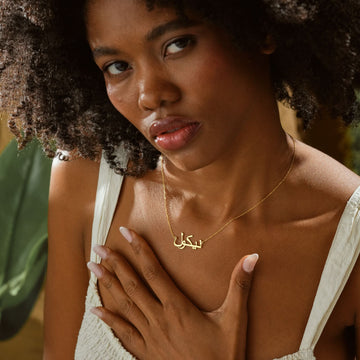 Personalized Arabic Name Necklace worn by a model, featuring gold vermeil finish and delicate design.