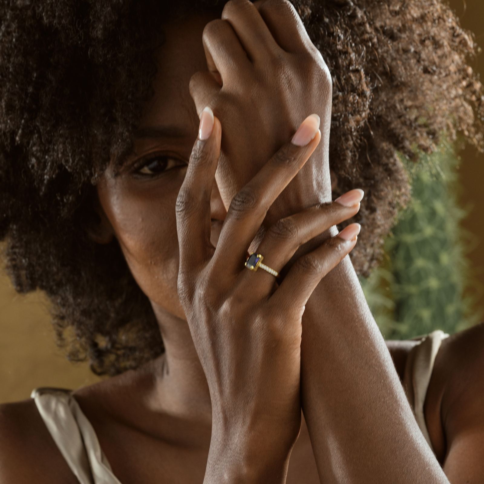 Rectangle Statement Birthstone Ring worn on a woman's hand, showcasing its elegant design and colorful gemstone.