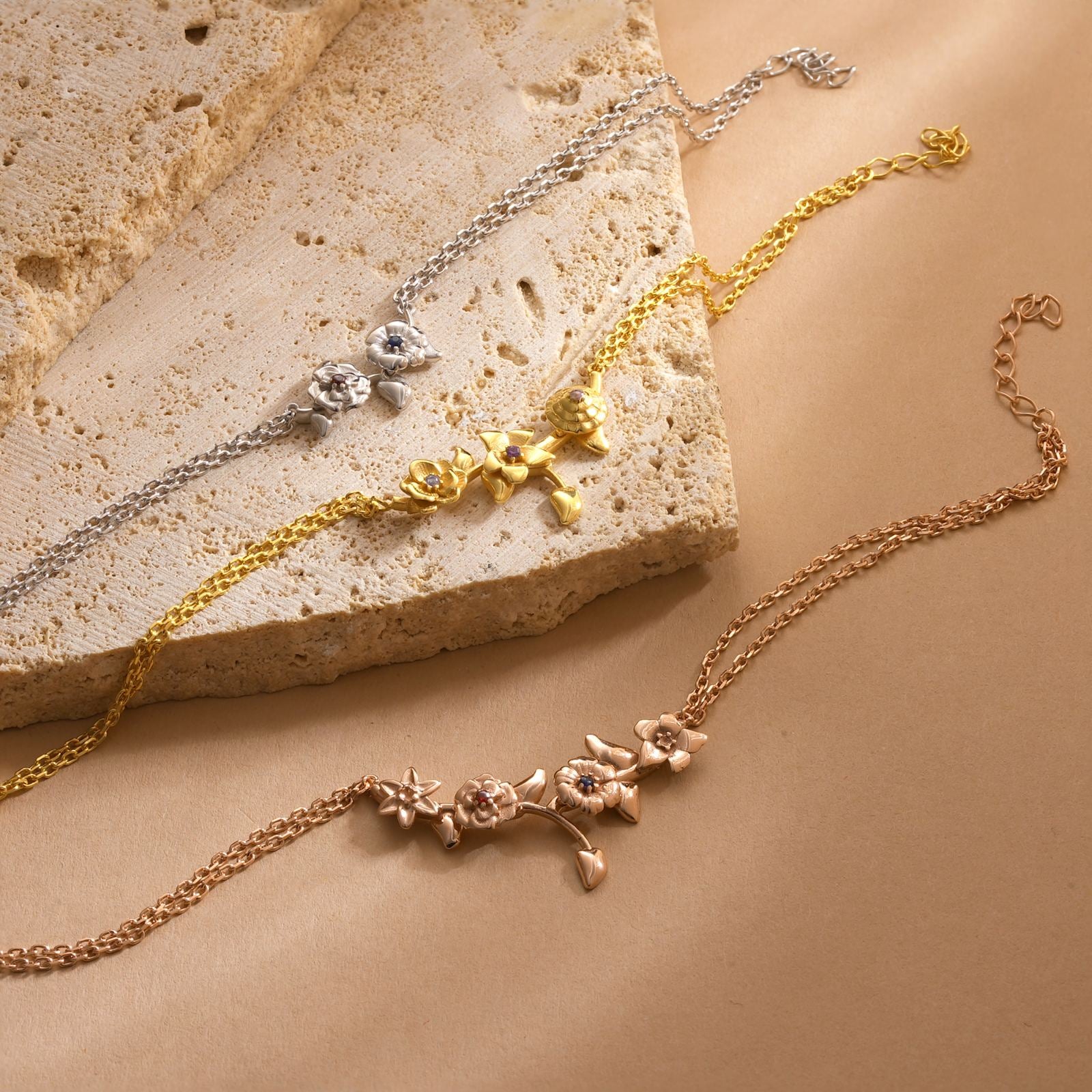 Custom 3D Birth Flower Bracelet displayed in gold, rose gold, and silver options on a textured background.