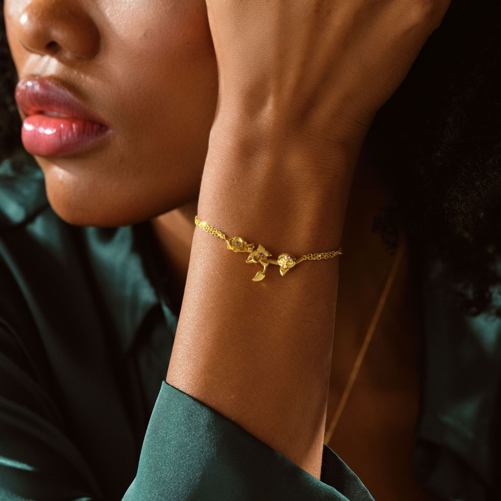 Close-up of a woman wearing a Custom 3D Birth Flower Bracelet in gold, showcasing its intricate design.