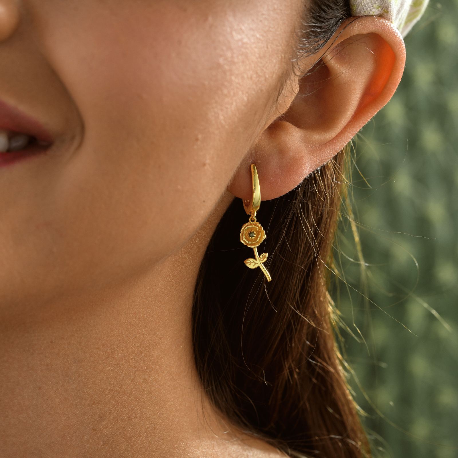 Model wearing Birth Flower Hoop Earring in gold vermeil featuring a delicate floral design.