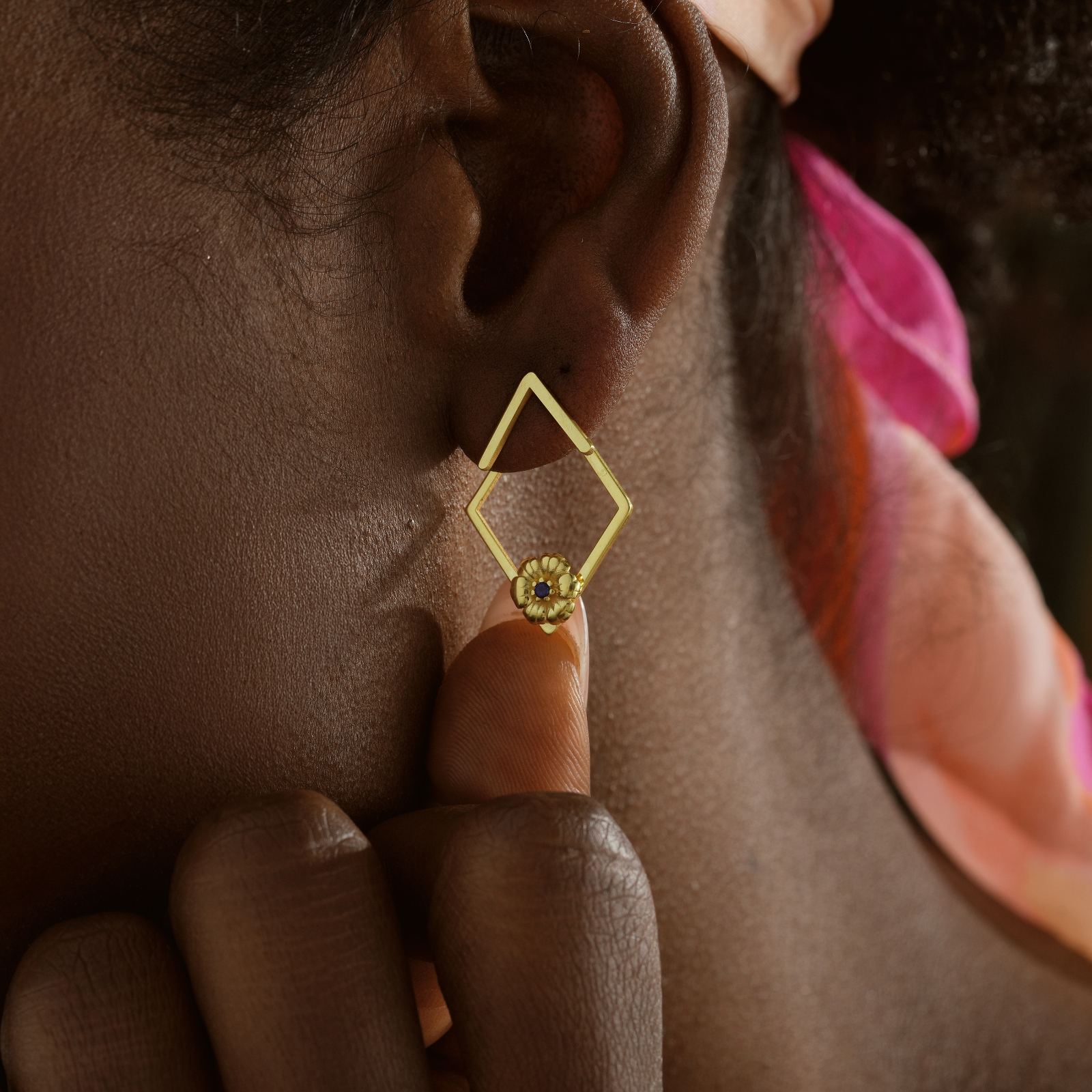 Charming Birth Flower Ear Jacket Earrings worn by a model showing the unique design with a diamond shape and floral detail.