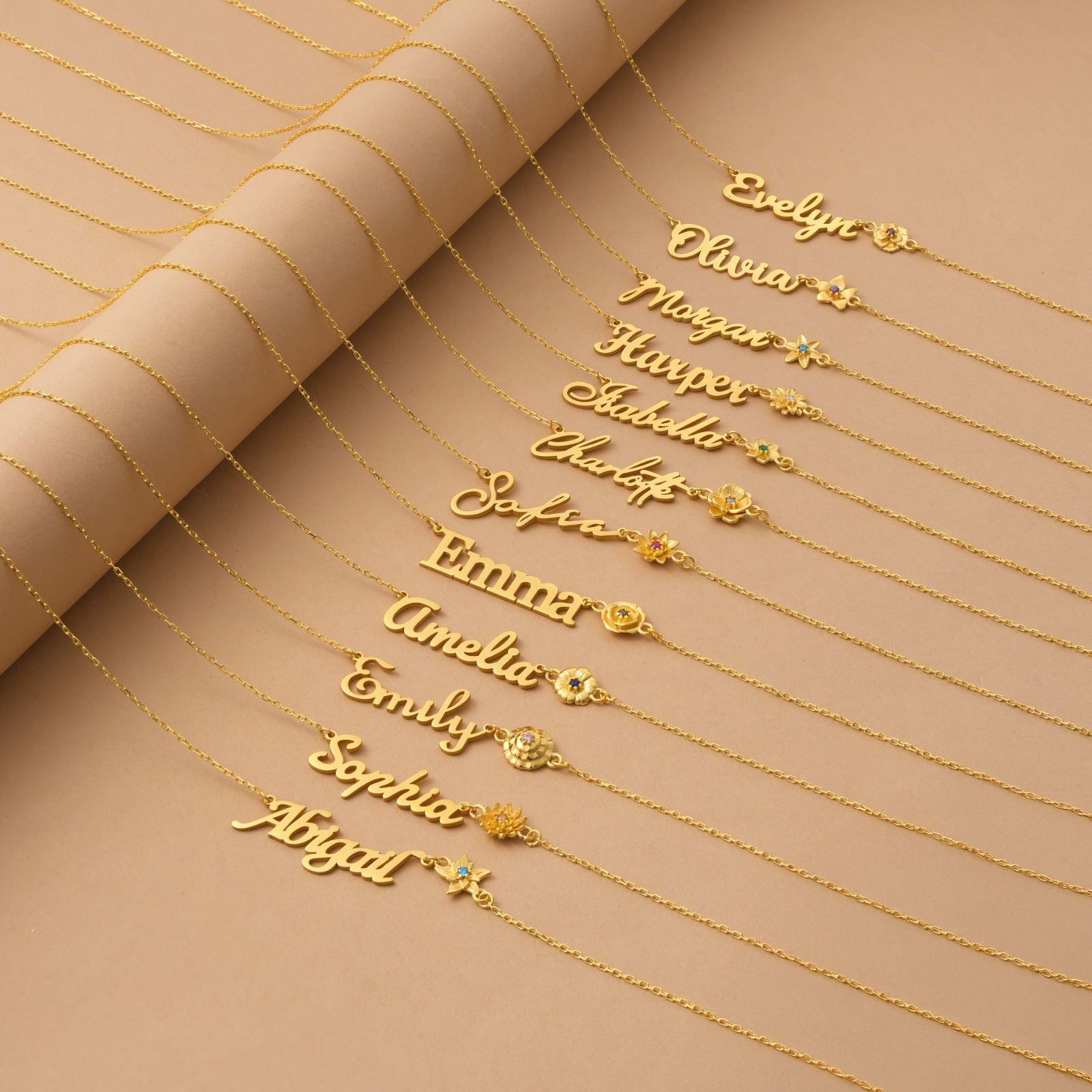 Personalized Birth Flower Name Necklace displayed on a soft background featuring various names in elegant script.