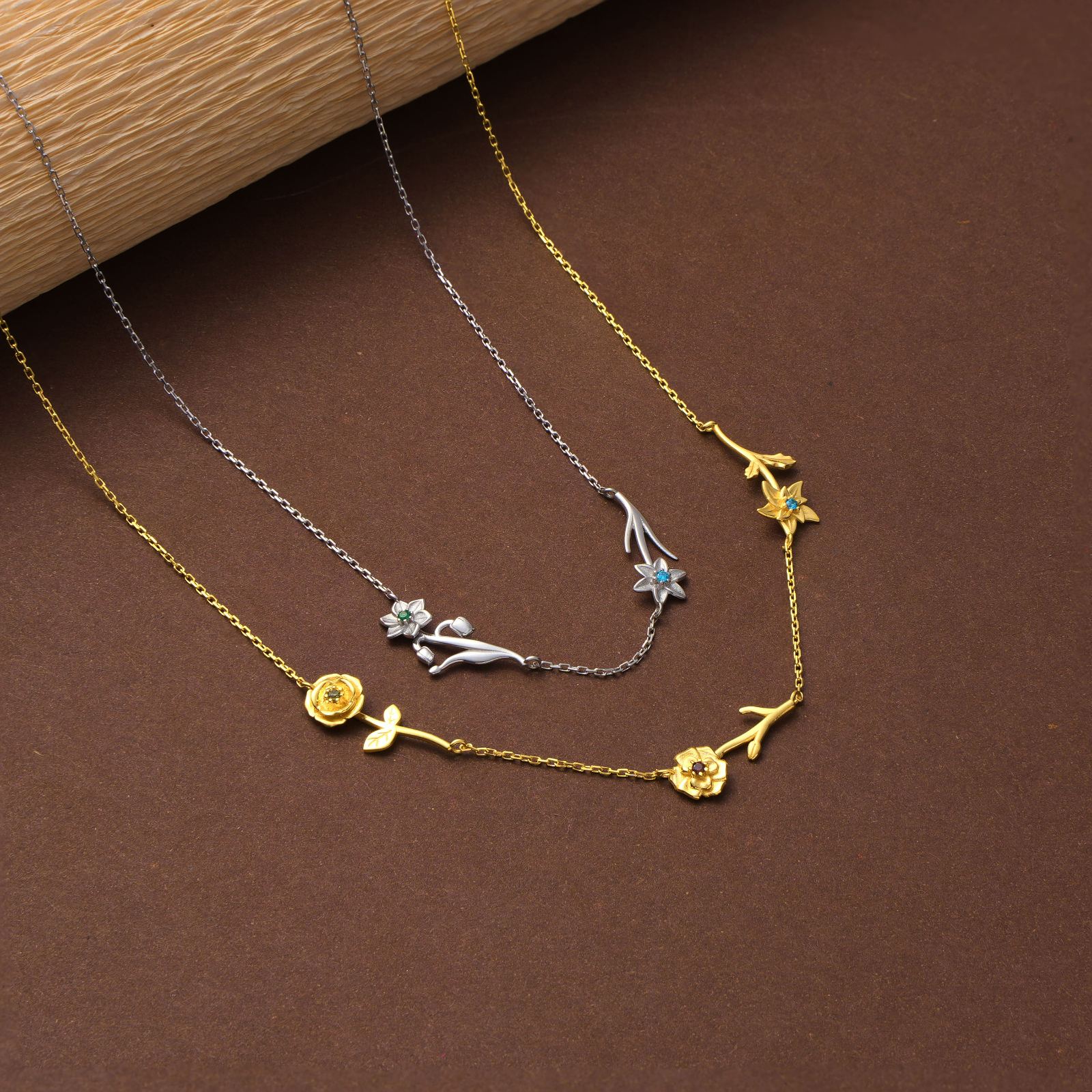 Personalized Birth Flower Necklace featuring delicate floral designs in gold and silver finishes.