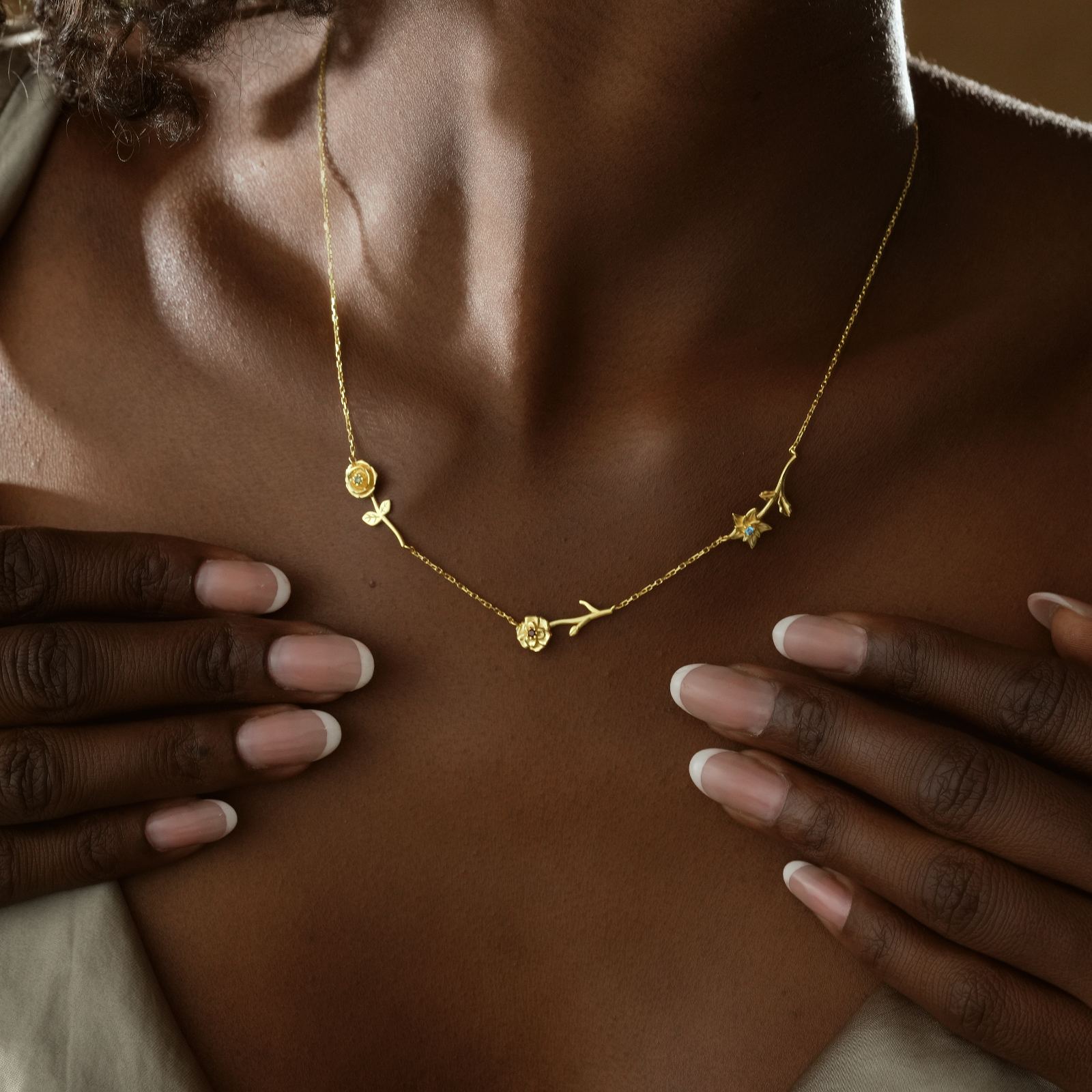 Personalized Birth Flower Necklace worn by a model, featuring gold vermeil and unique birth flower charms.