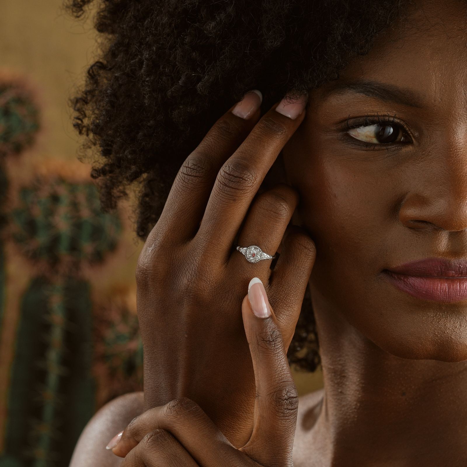 Woman showcasing a Custom Birth Flower Ring made of high-quality solid 925 sterling silver.