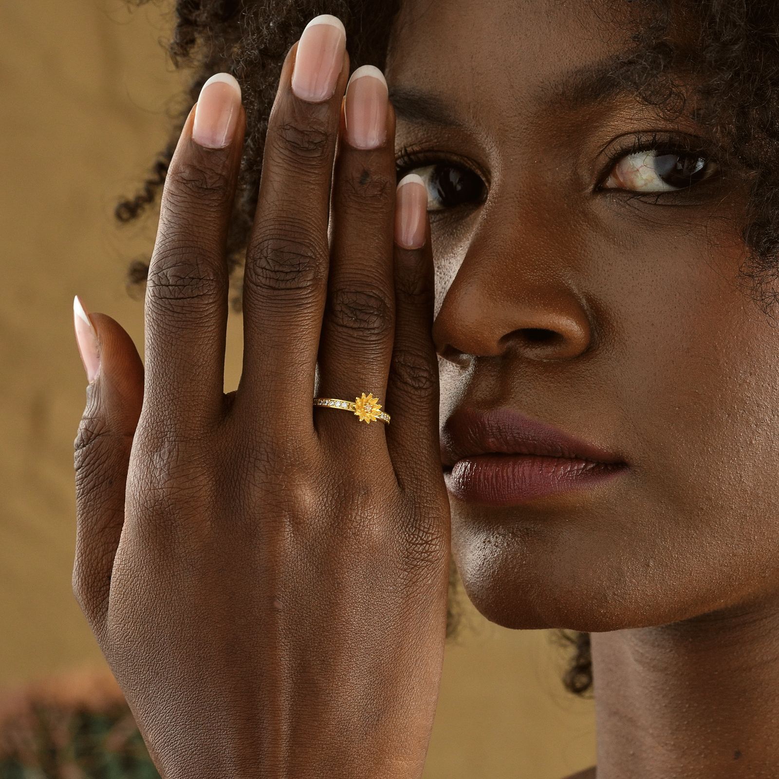 Close-up of a model wearing a Personalized Birth Flower Ring in Silver Cubic Zirconia.