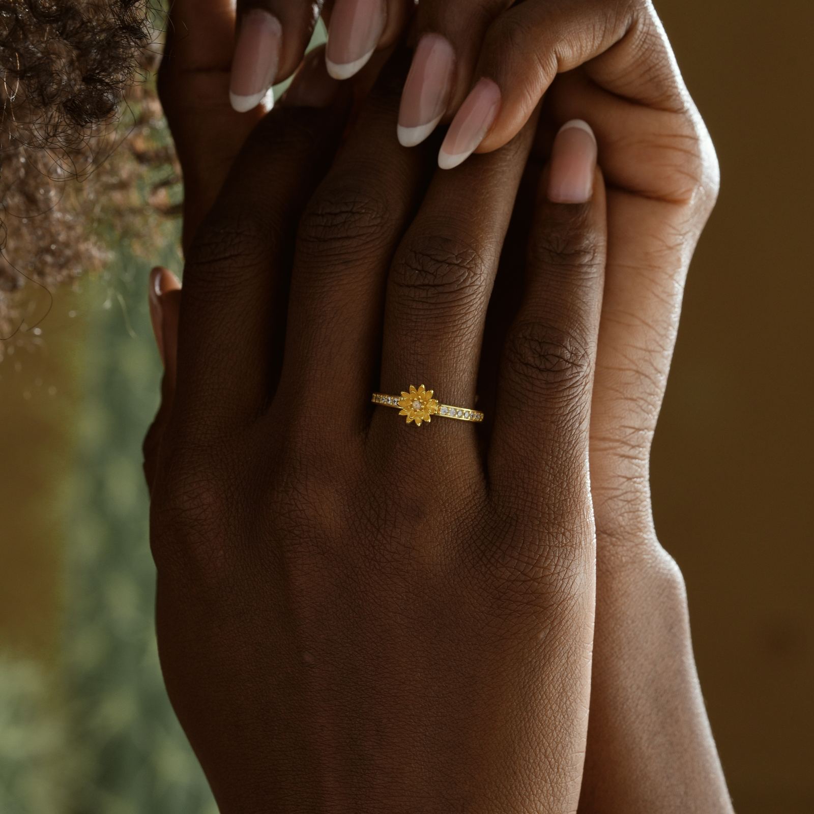 Personalized Birth Flower Ring in Silver Cubic Zirconia worn on hand with a floral design.