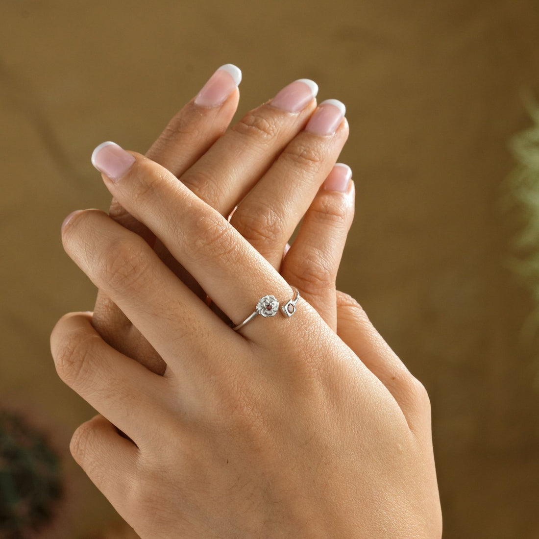 Adjustable Open Ring-Custom Birth Flower Ring worn on a hand with elegantly manicured nails.