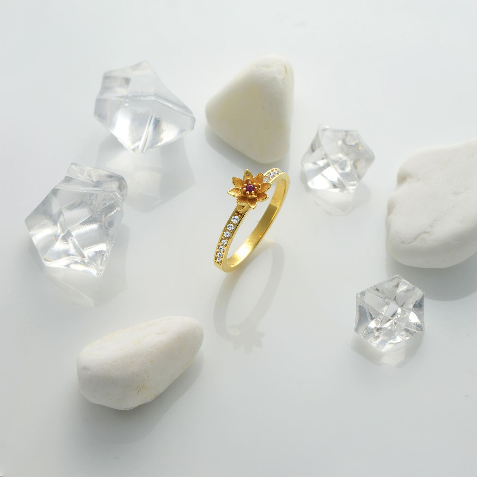 Personalized Birth Flower Ring in Silver Cubic Zirconia displayed among clear crystal stones.