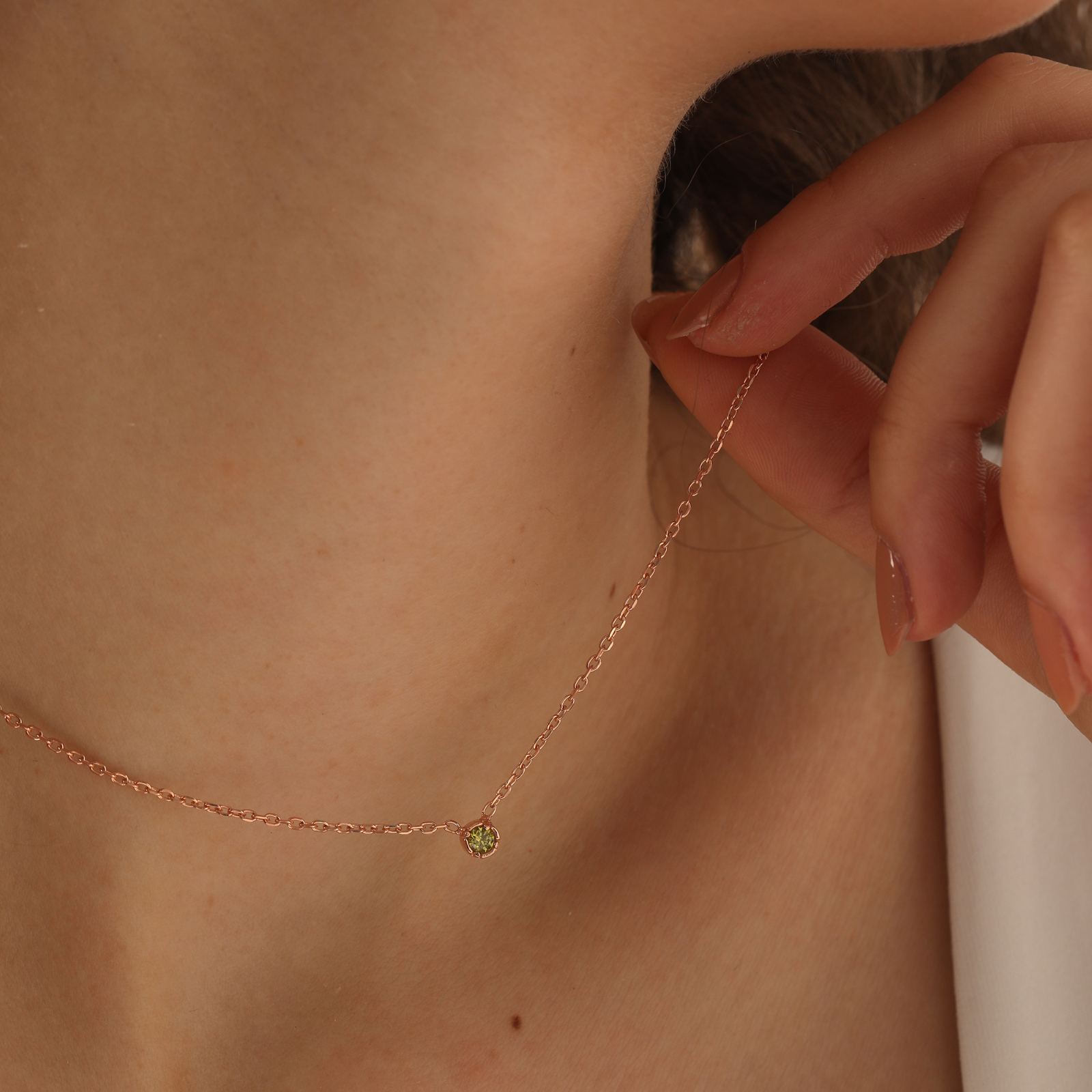 Personalized Birthstone Necklace in rose gold with a sparkling gemstone detail.