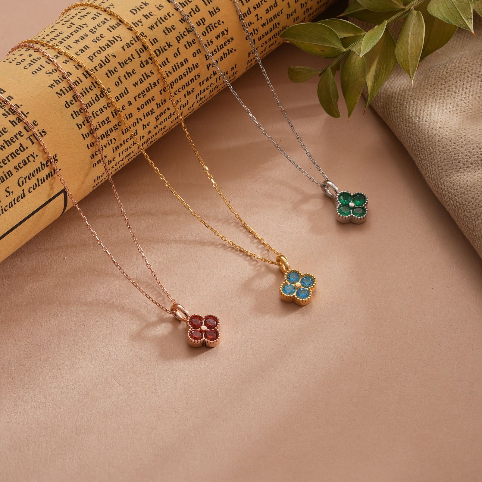 Elegant Clover Birthstone Necklace featuring three colors: red, green, and blue, on delicate chains.
