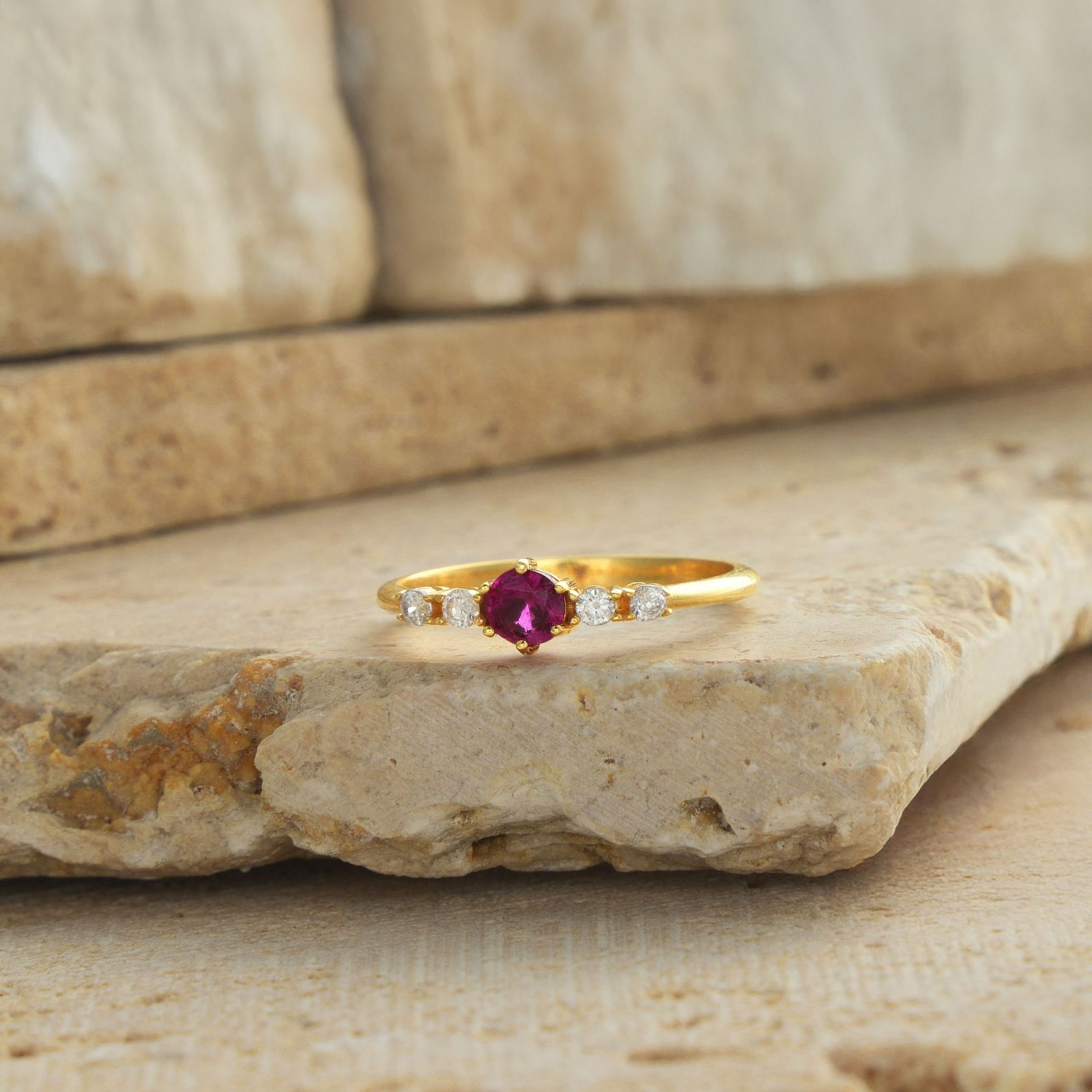 Round Cut Birthstone Ring CZ Custom Gemstone Sterling with a ruby center stone set on a gold band