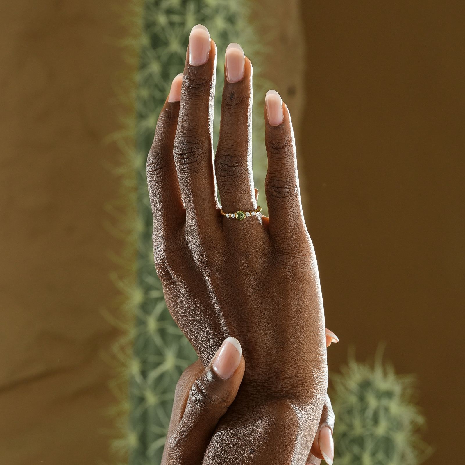 Round Cut Birthstone Ring displayed on a hand, showcasing custom gemstone settings in high-quality sterling silver.