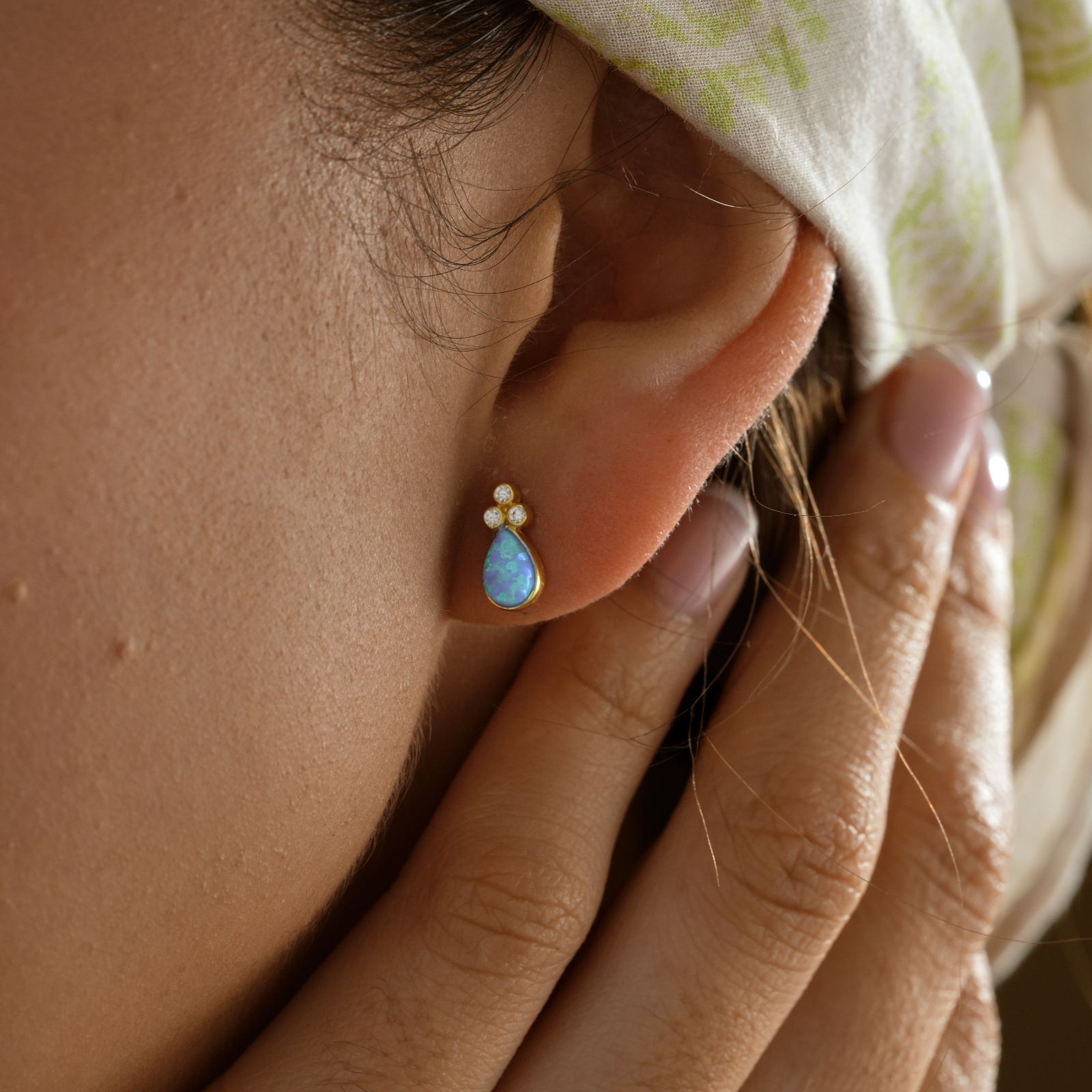 Elegant Blue Opal Ring Sterling Silver worn as earrings, featuring high-quality opal and elegant design.
