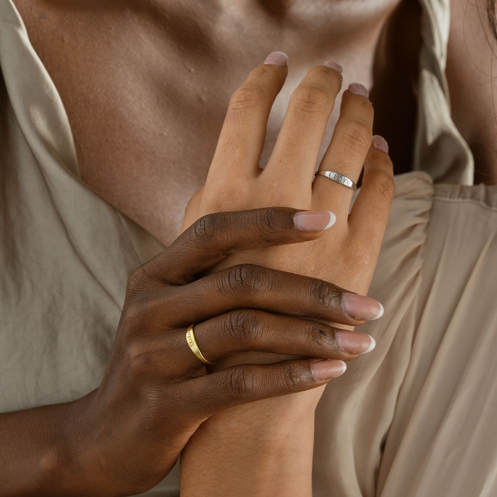 Personalized Name Ring showcased on hands, featuring custom stacking jewelry in gold and silver finish.