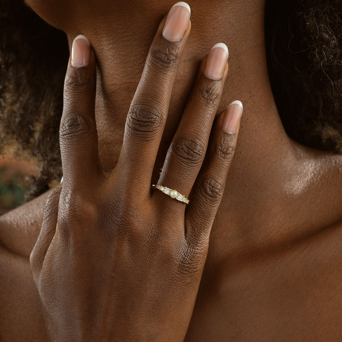 Vintage Cross Signet Ring showcased on a model's hand with a natural background and elegant finish.