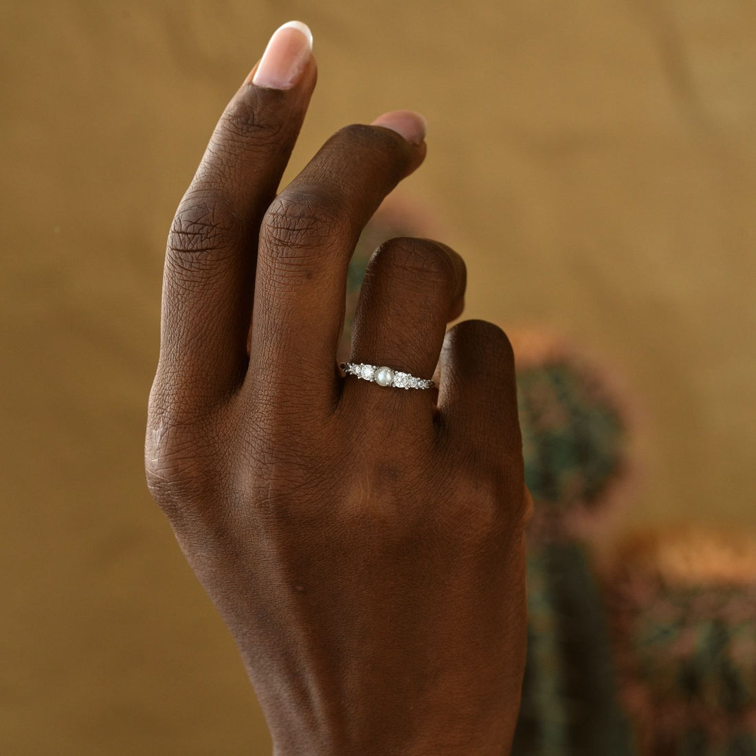 Vintage Cross Signet Ring showcased on a model's hand with a natural background and elegant finish.