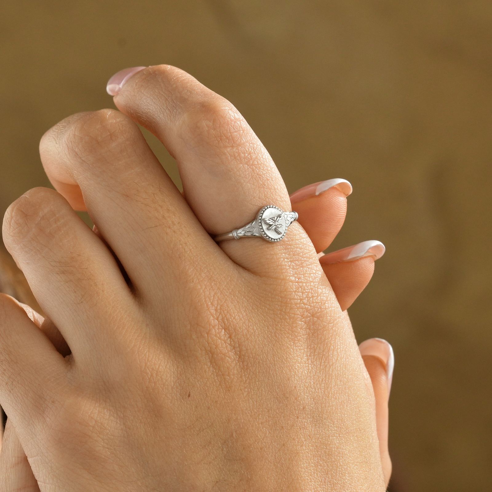 Woman wearing a Dragonfly Pinky Ring in high-quality solid 925 sterling silver, featuring a delicate design.