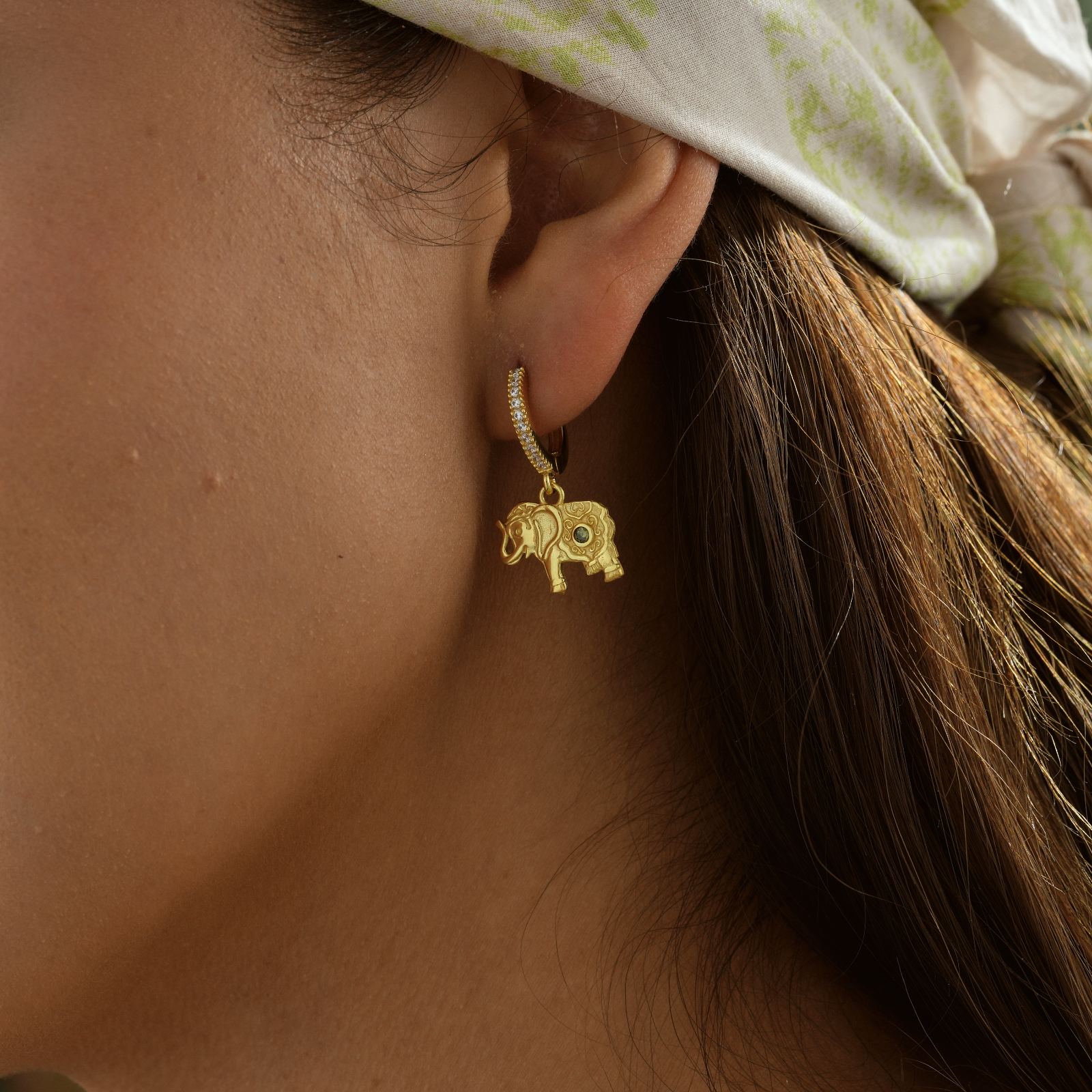 Elephant Hoop Earrings Sterling Silver worn by a model, showcasing high-quality craftsmanship and design.