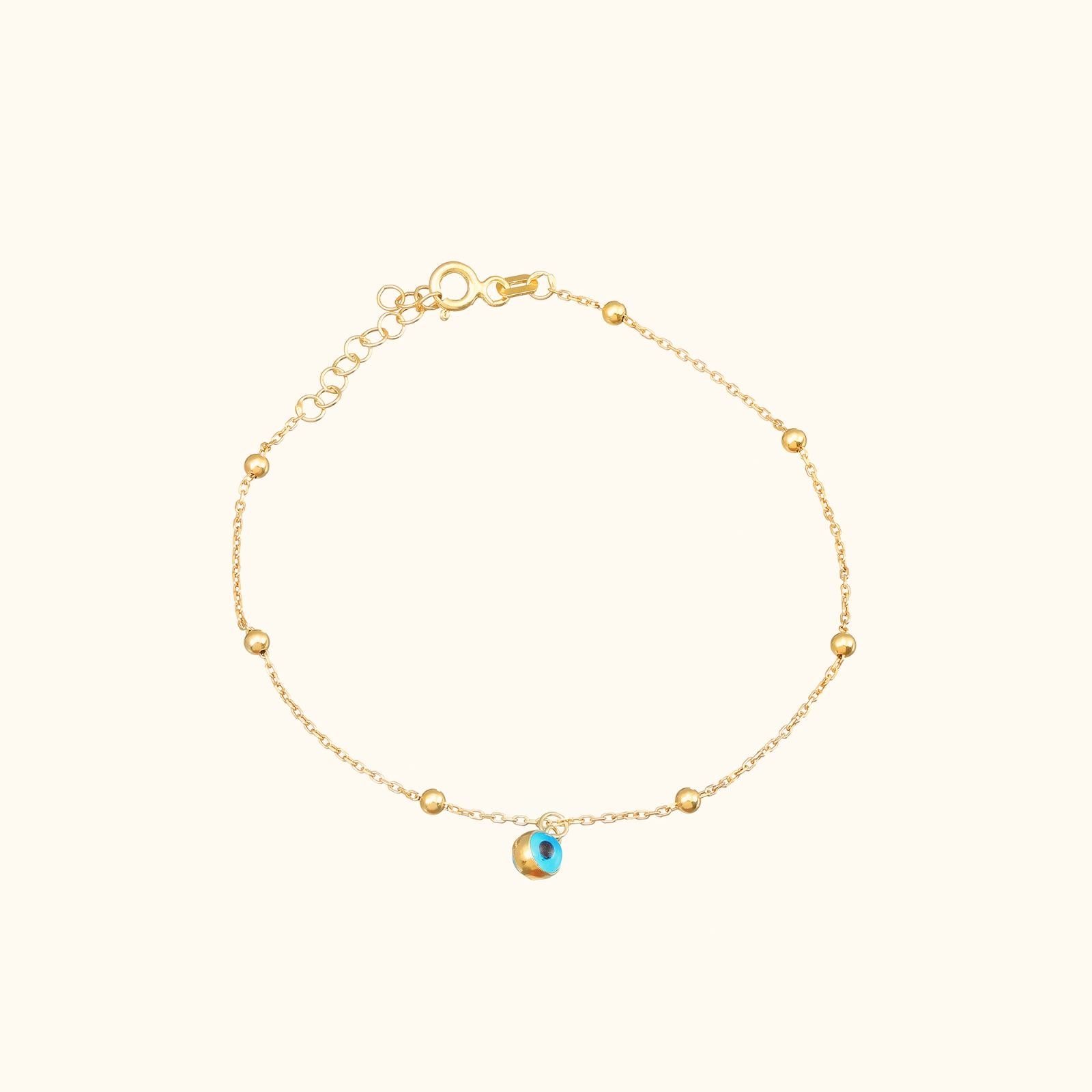 Charming Evil Eye Bracelet Sterling Silver with gold vermeil finish and lobster claw closure.