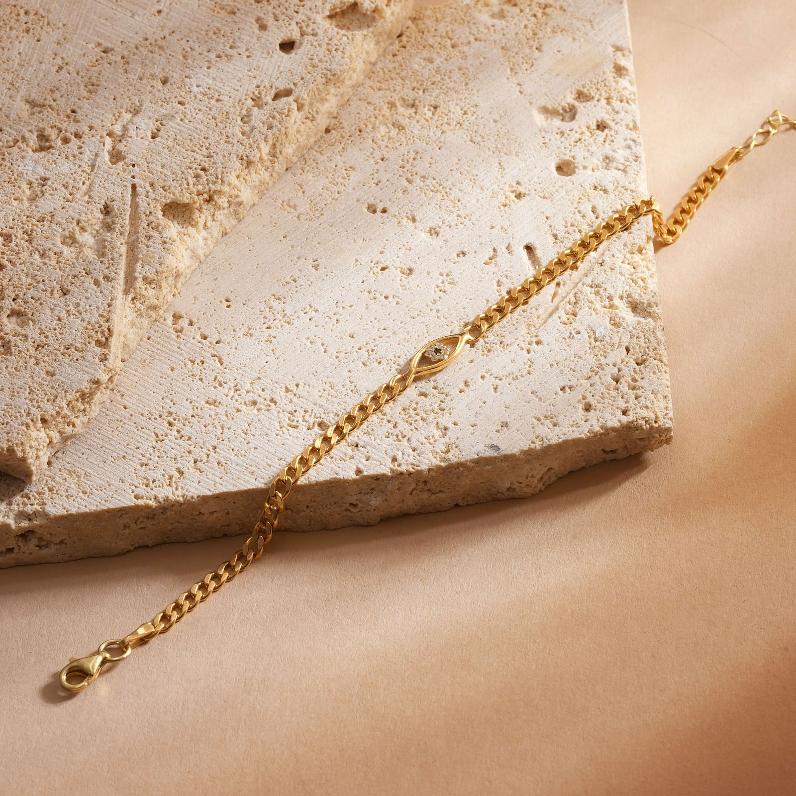 Evil Eye Curb Chain Bracelet Elegant Sterling Silver on a neutral background with a lobster claw closure.