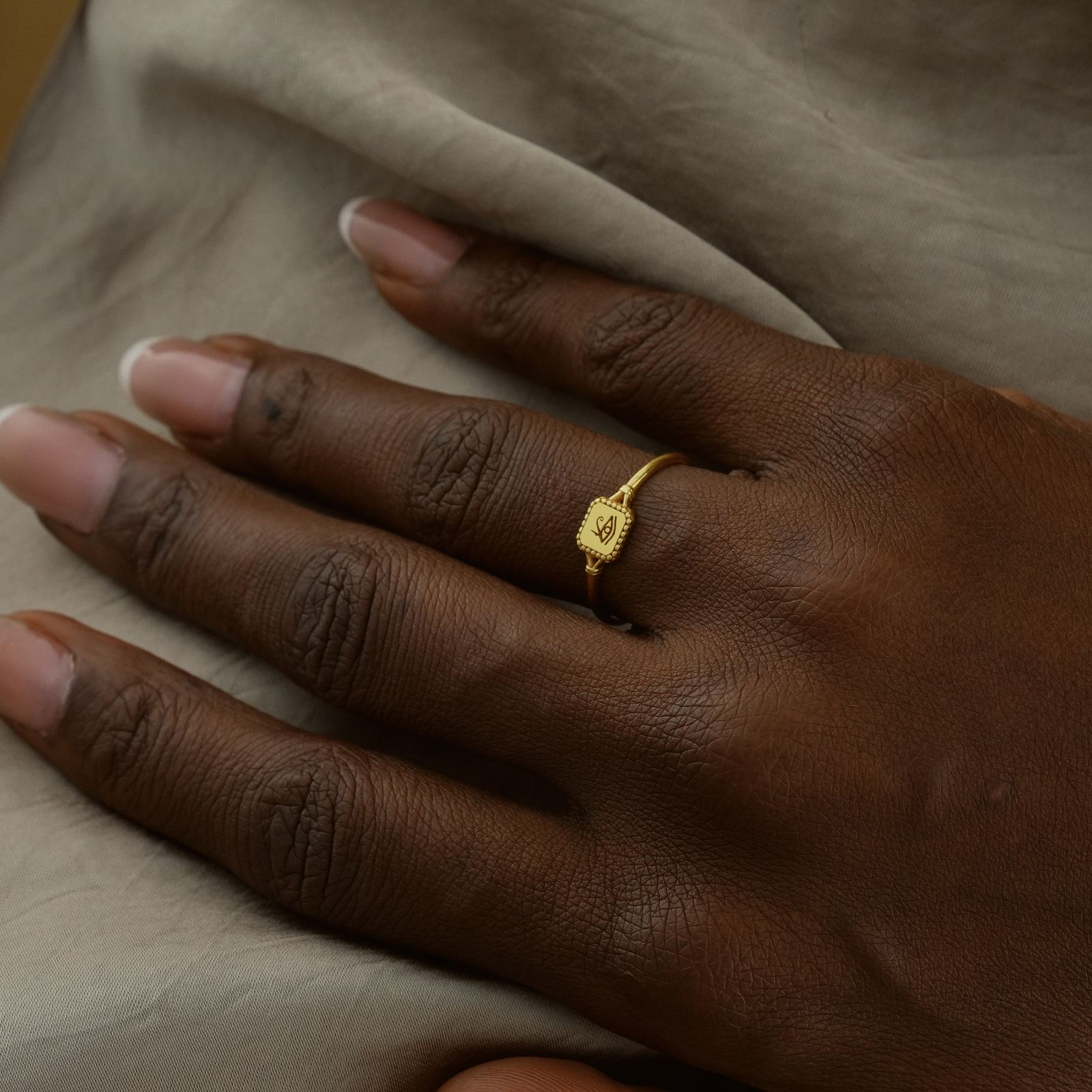 Eye of Ra Signet Ring on a hand, made of gold vermeil, showcasing intricate design.