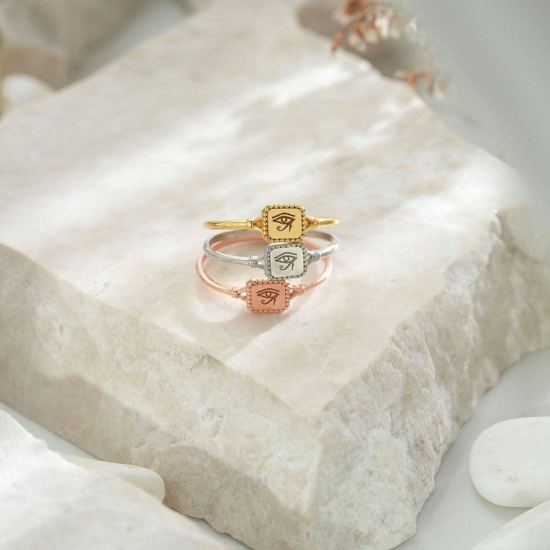 Hand wearing an Eye of Ra Signet Ring in gold vermeil, showcasing elegant jewelry design.