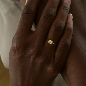 Hand wearing an Eye of Ra Signet Ring in gold vermeil, showcasing elegant jewelry design.
