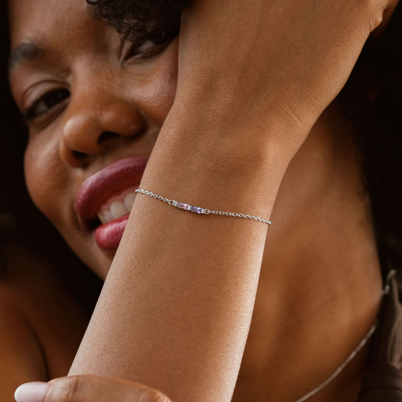 Elegant Gold Filled Birthstone Bracelet worn by a woman showcasing its beauty on her wrist.
