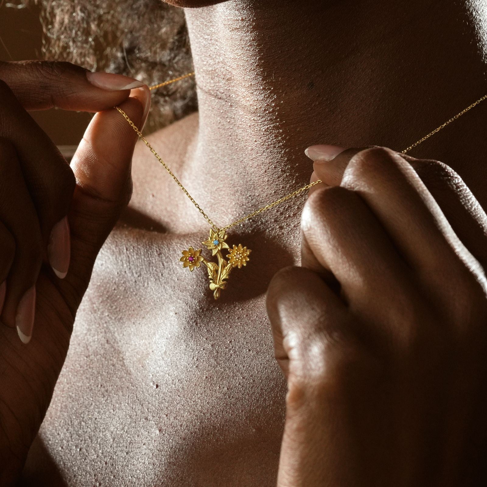 Gold Filled Birth Flower Bouquet Necklace worn by a person, showcasing delicate floral design in gold.