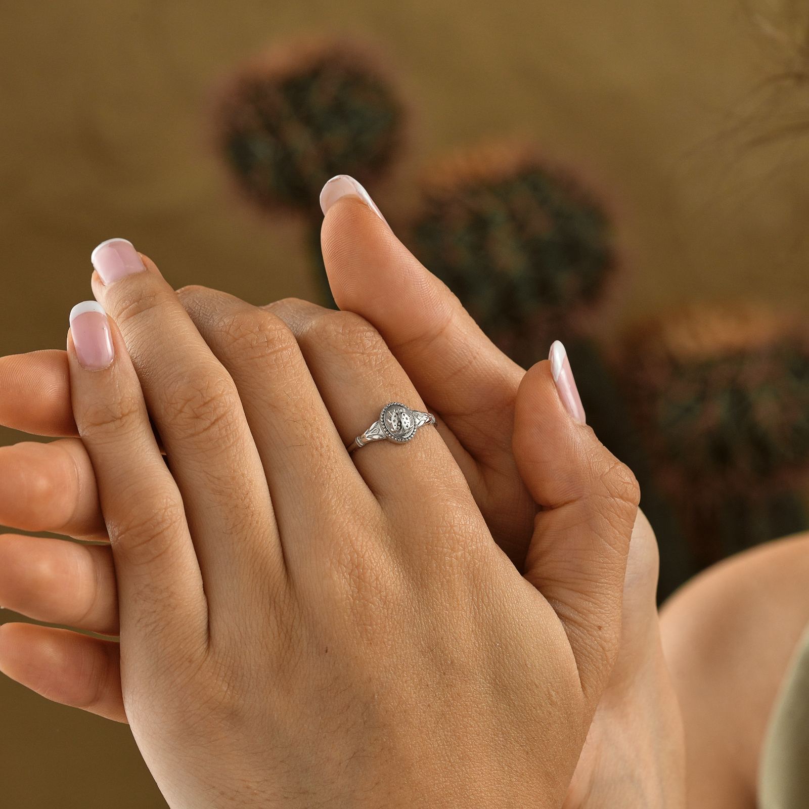 Ladybug Signet Ring on a woman's hand, showcasing elegant design in high-quality sterling silver.