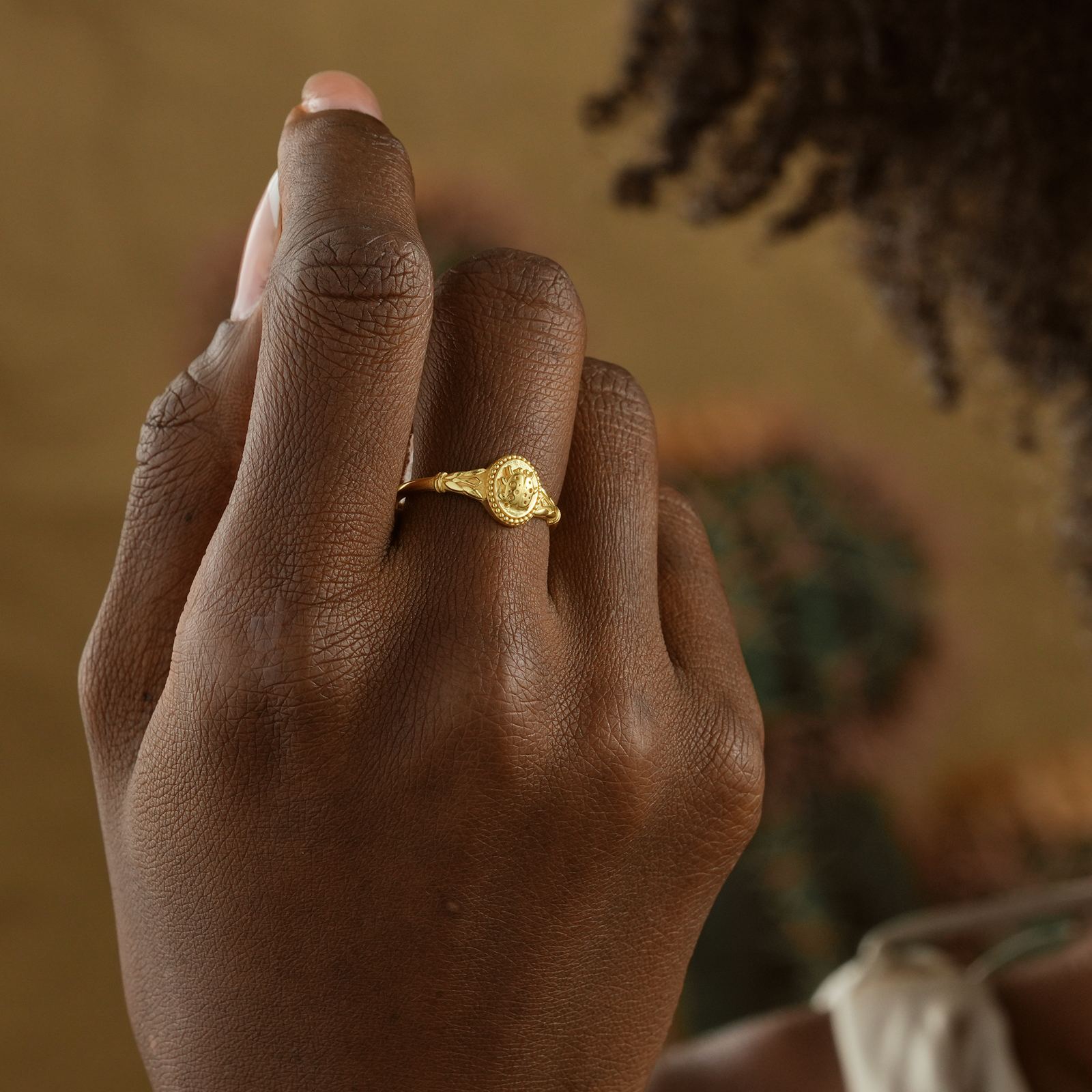 Ladybug Signet Ring worn on a hand, showcasing the elegant design in gold vermeil.