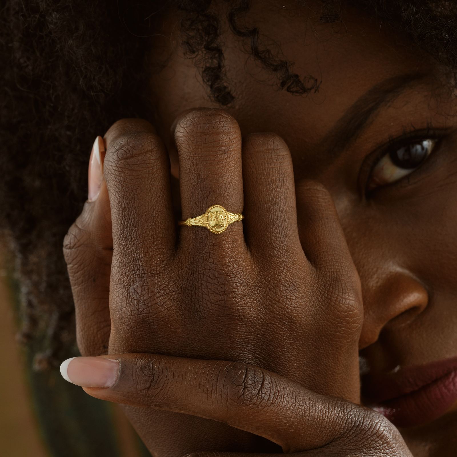 Ladybug Signet Ring displayed on a model's hand, showcasing its intricate design in gold vermeil.