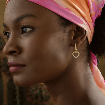 Elegant Heart Hoop Earring for Her worn by a woman with a pink scarf in a close-up shot.