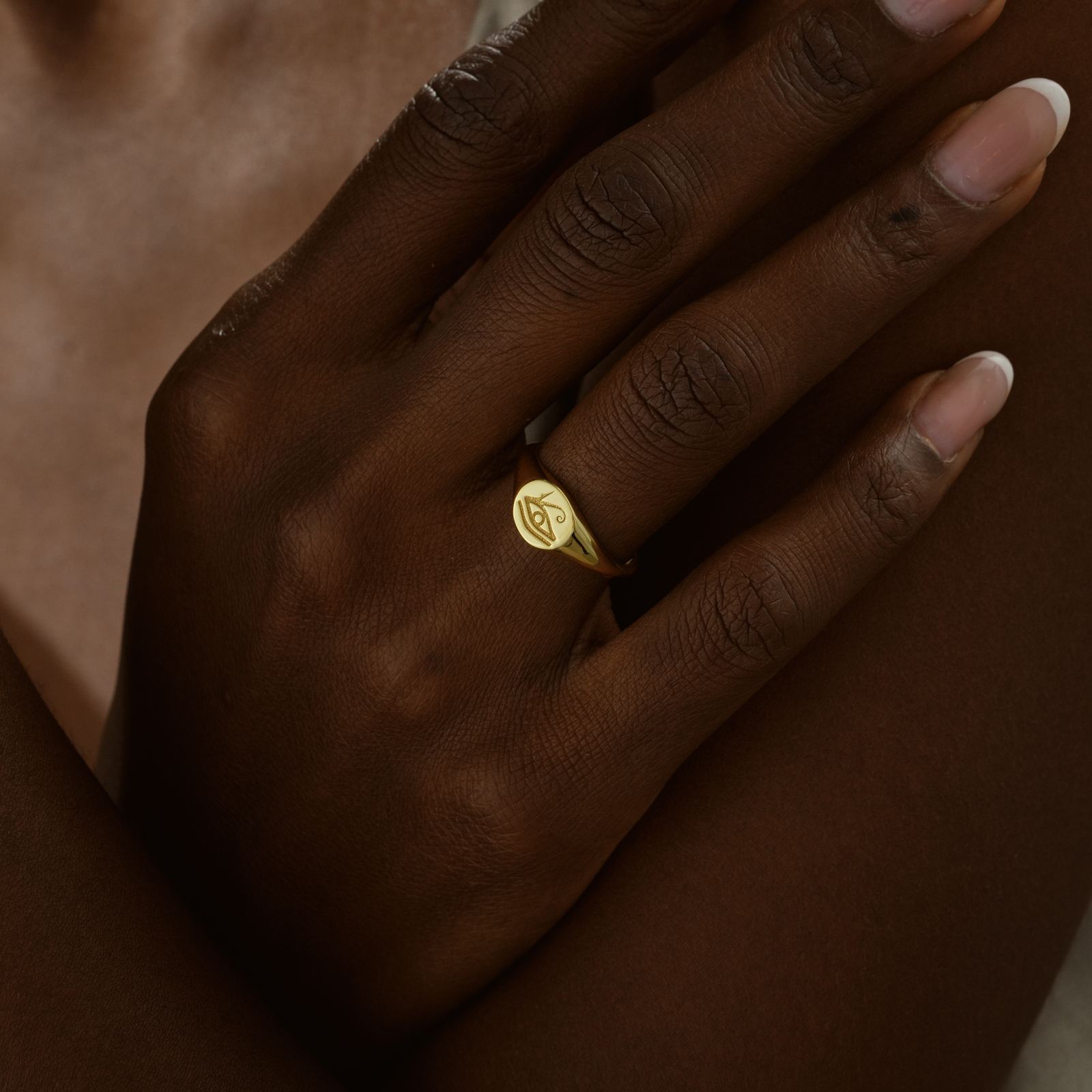 Horus Eye Signet Ring worn on a hand, showcasing its elegant gold vermeil finish.