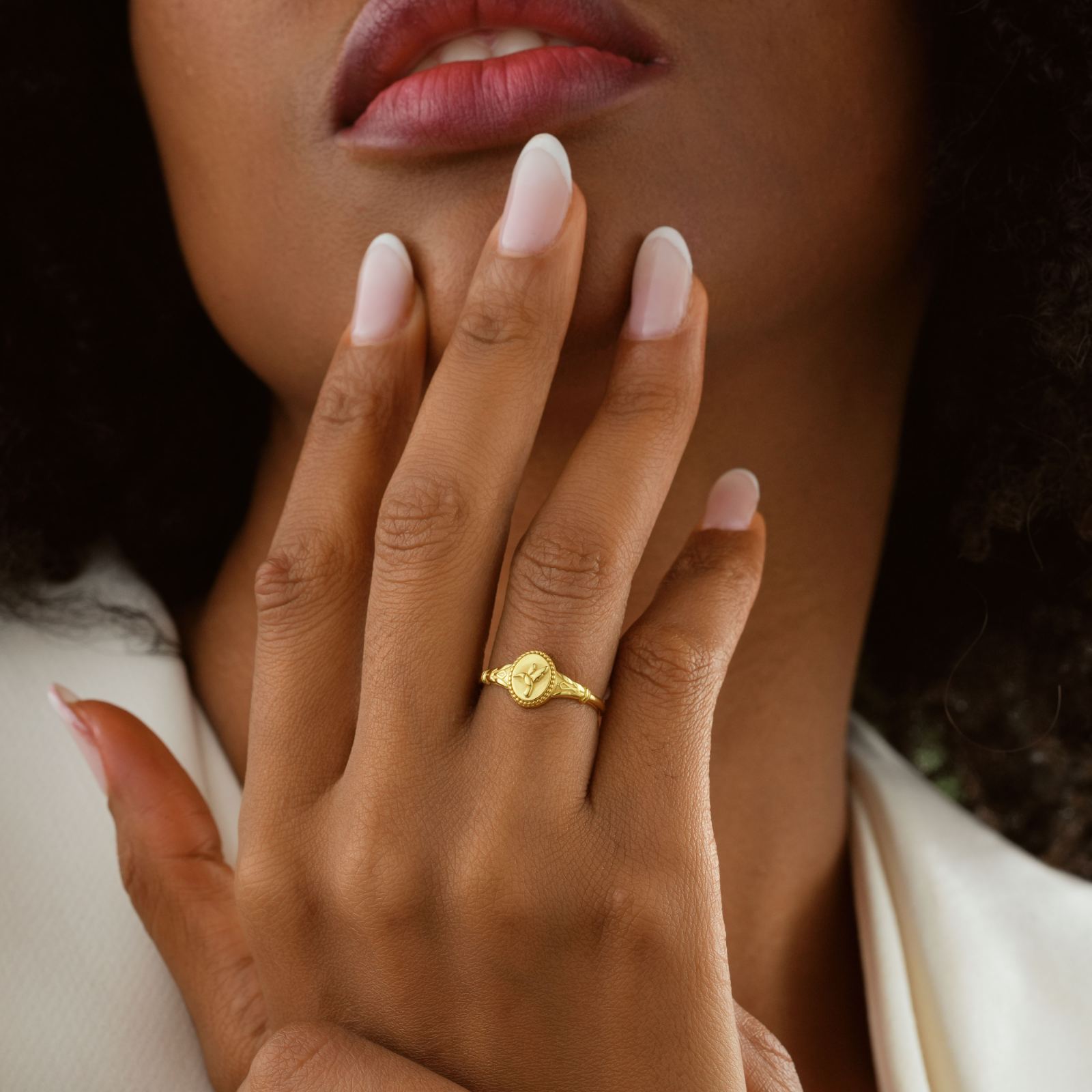 Hummingbird Signet Pinky Ring Sterling Silver worn on hand with elegant fingers and natural nails.