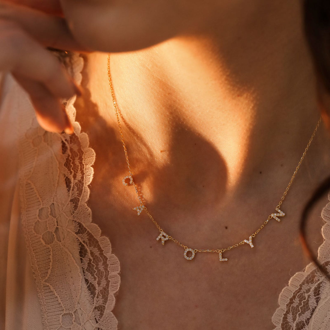 Personalized Tiny Initial Necklace featuring sparkling cubic zirconia letters in gold vermeil finish.