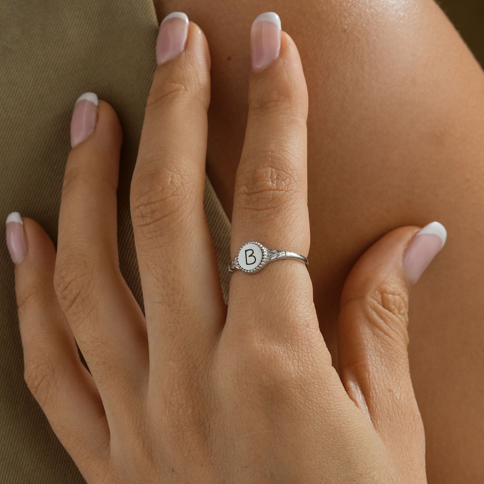 Personalized Initial Signet Letter Ring worn on a finger showcasing a "B" initial design in high-quality silver.