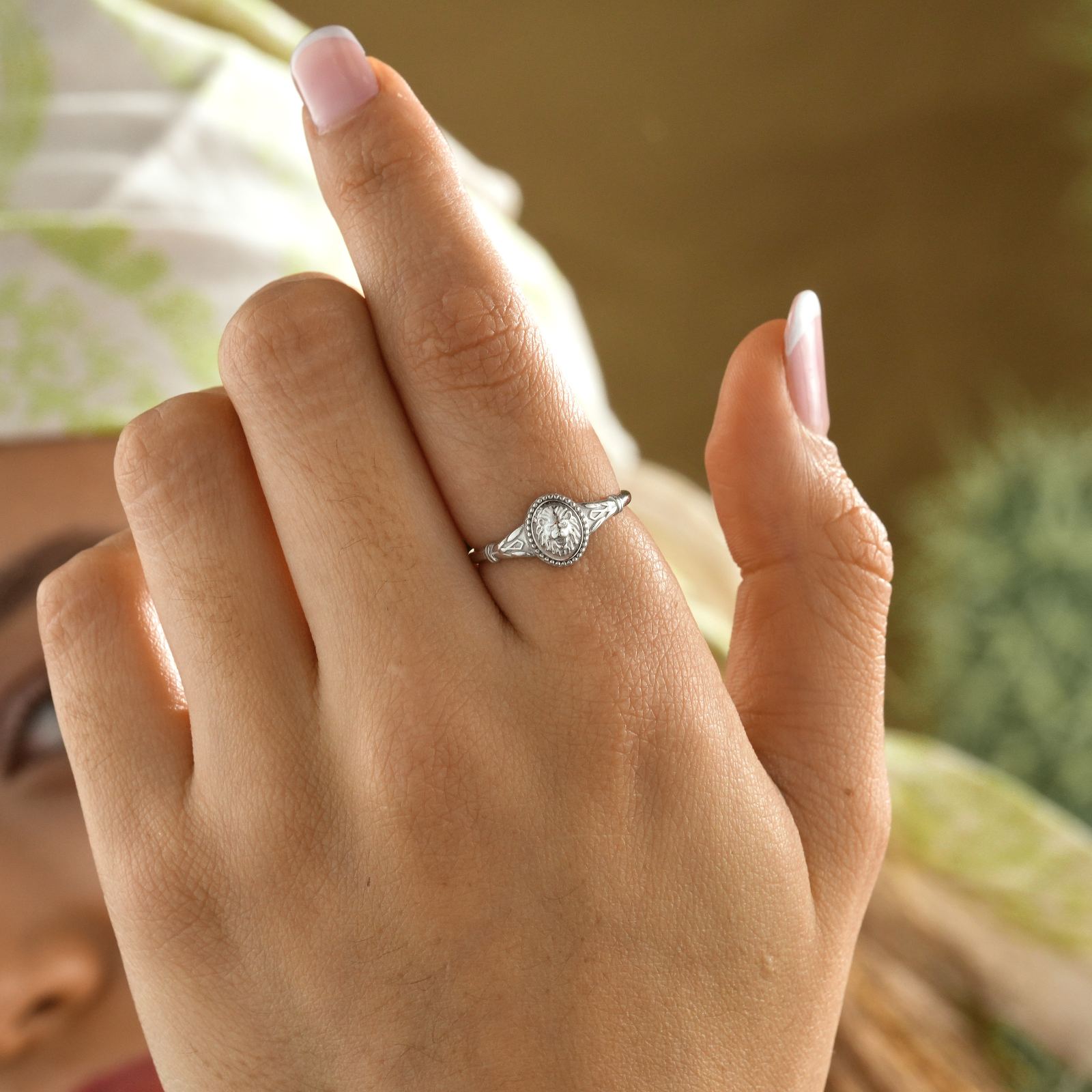 Lion Ring for Leo seen on a hand, crafted in minimalist sterling silver with a sleek design.