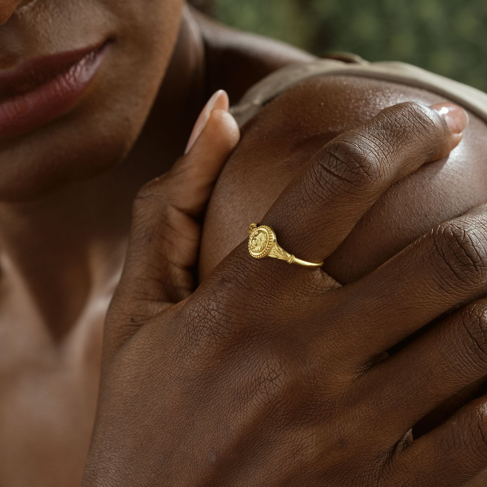Lion Ring worn by a model showcasing minimalist design and gold finish on finger.