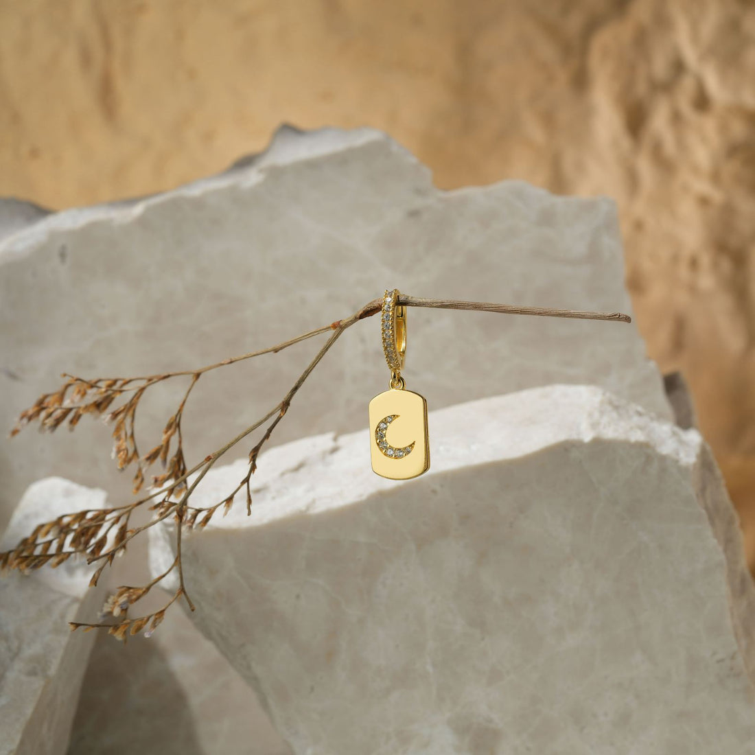 Model wearing Elegant Moon Shaped Hoop Earring, showcasing its stylish design with a gold vermeil finish.