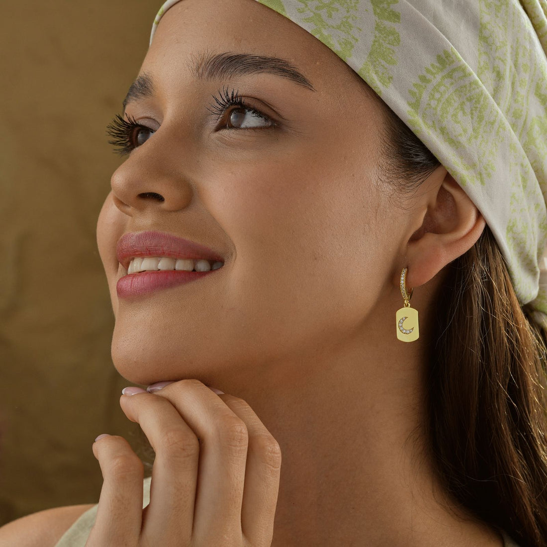 Model wearing Elegant Moon Shaped Hoop Earring, showcasing its stylish design with a gold vermeil finish.