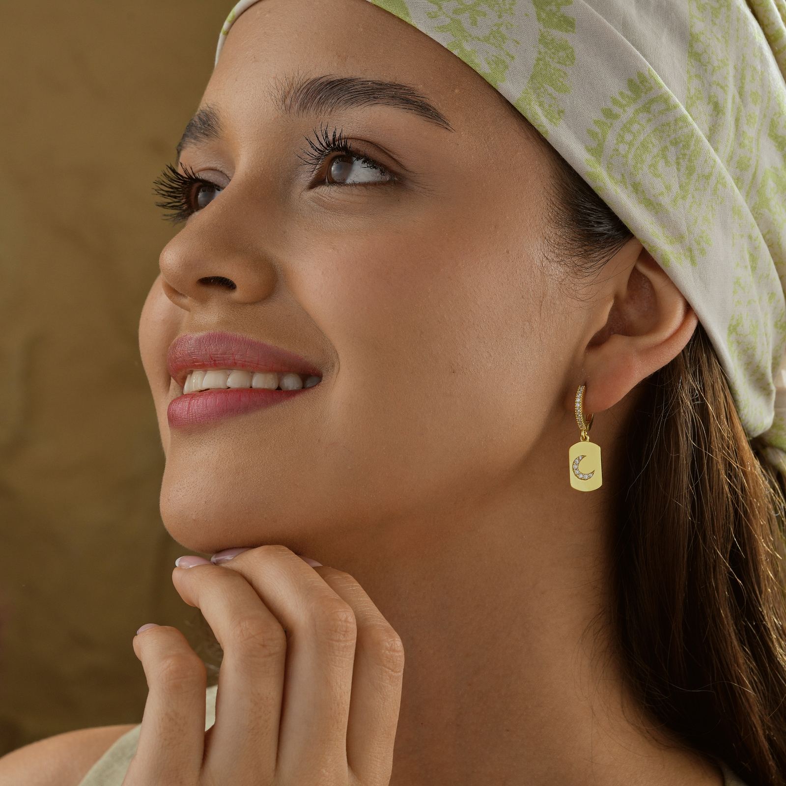 Model wearing Elegant Moon Shaped Hoop Earring, showcasing its stylish design with a gold vermeil finish.