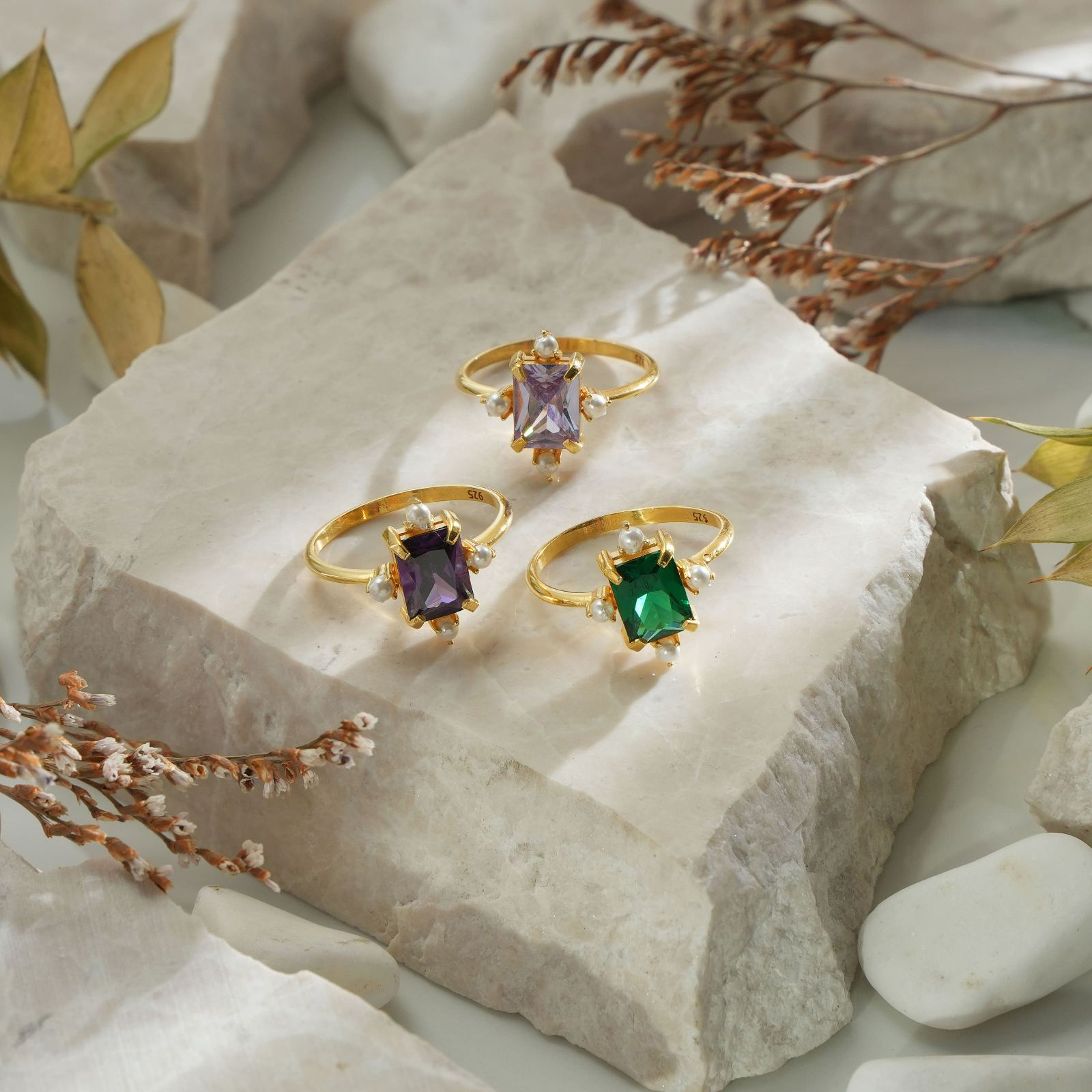 Rectangle Statement Ring featuring colorful birthstones on a natural stone background.