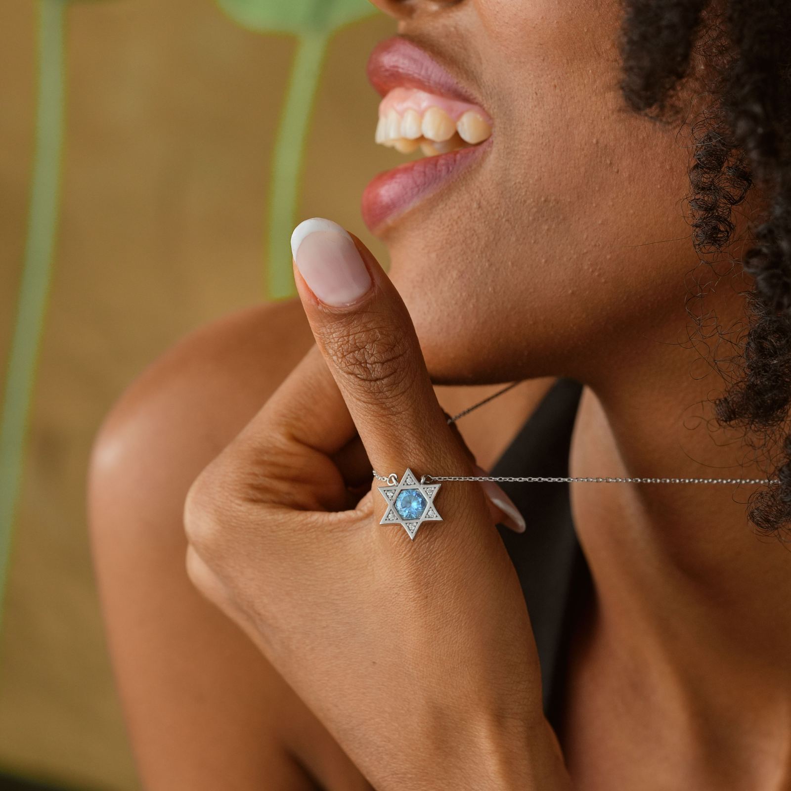 Model wearing a Star of David Necklace Elegant Silver, highlighting its intricate design and sparkling details.