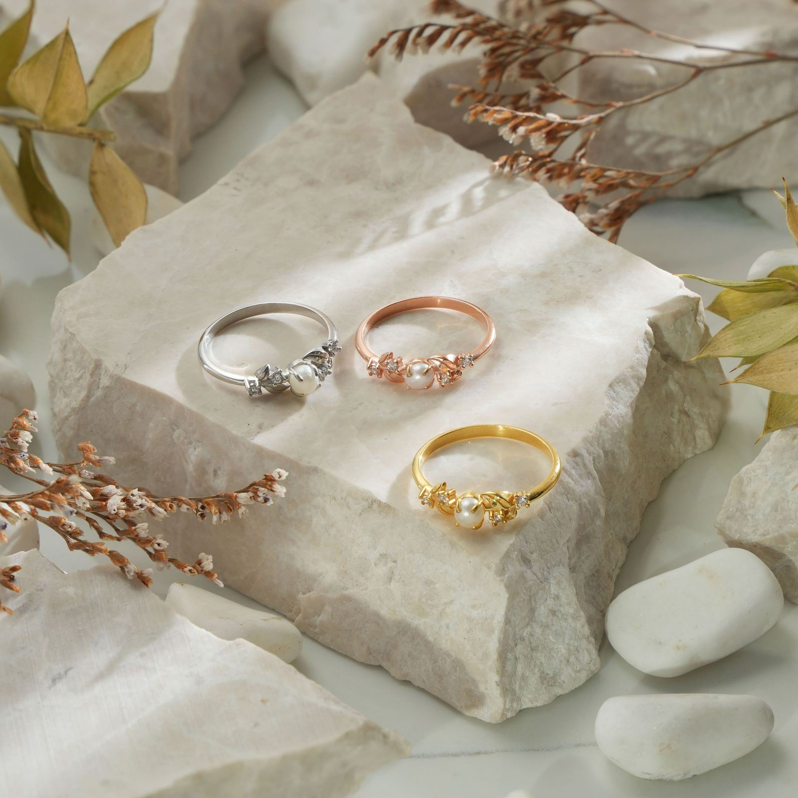Vintage Pearl Engagement Ring set on stone with three styles in silver, rose gold, and gold vermeil.